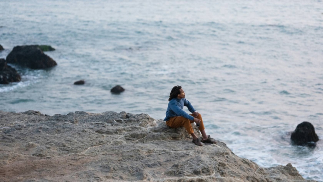 man sitting in beach