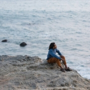 man sitting in beach