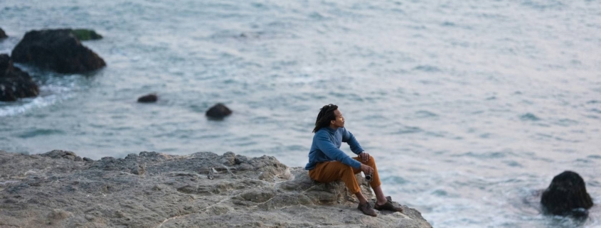 man sitting in beach