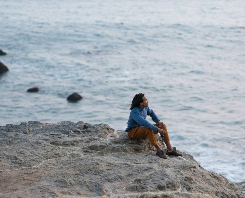 man sitting in beach